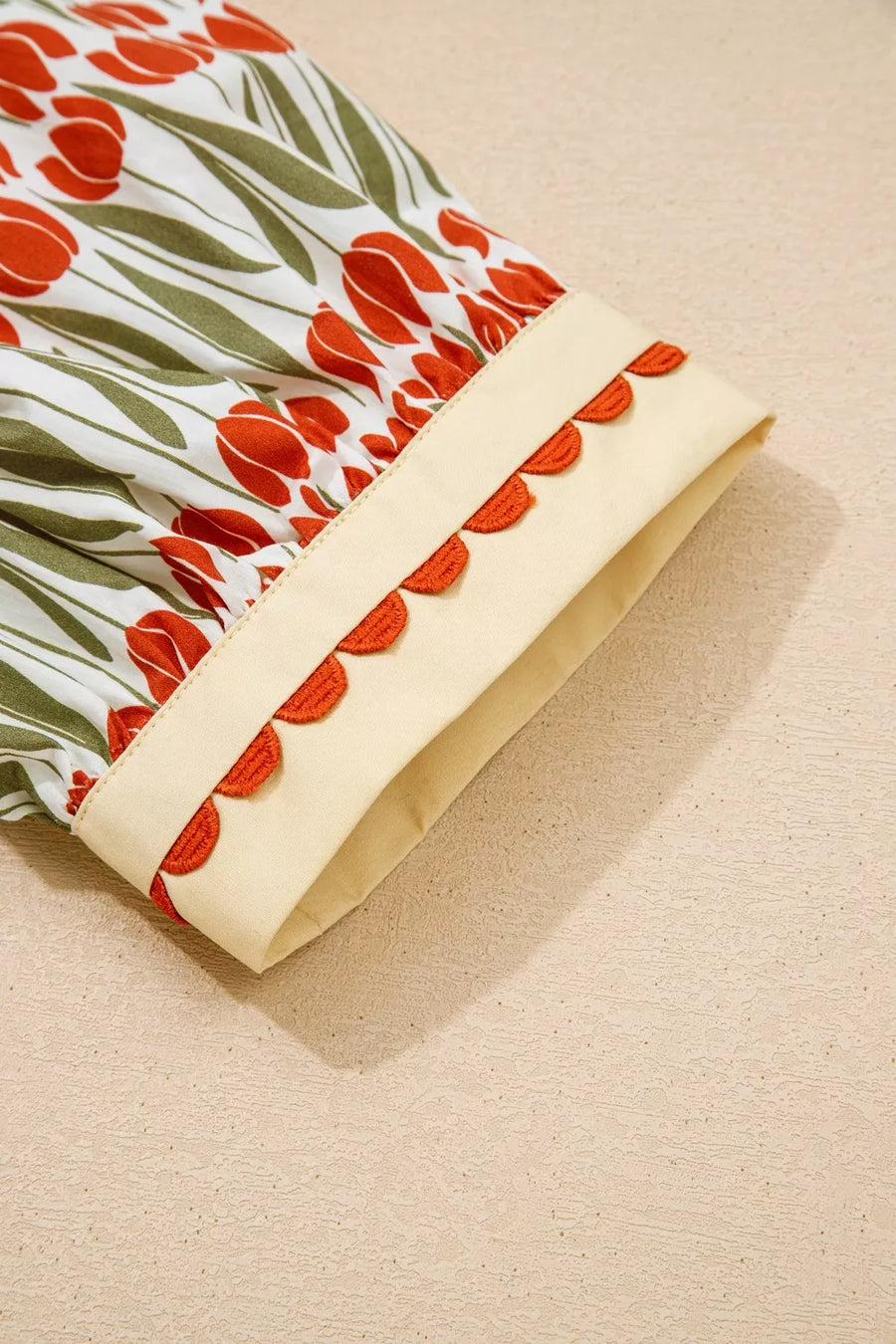Cotton mini dress with vibrant tulip print and scalloped trim detail