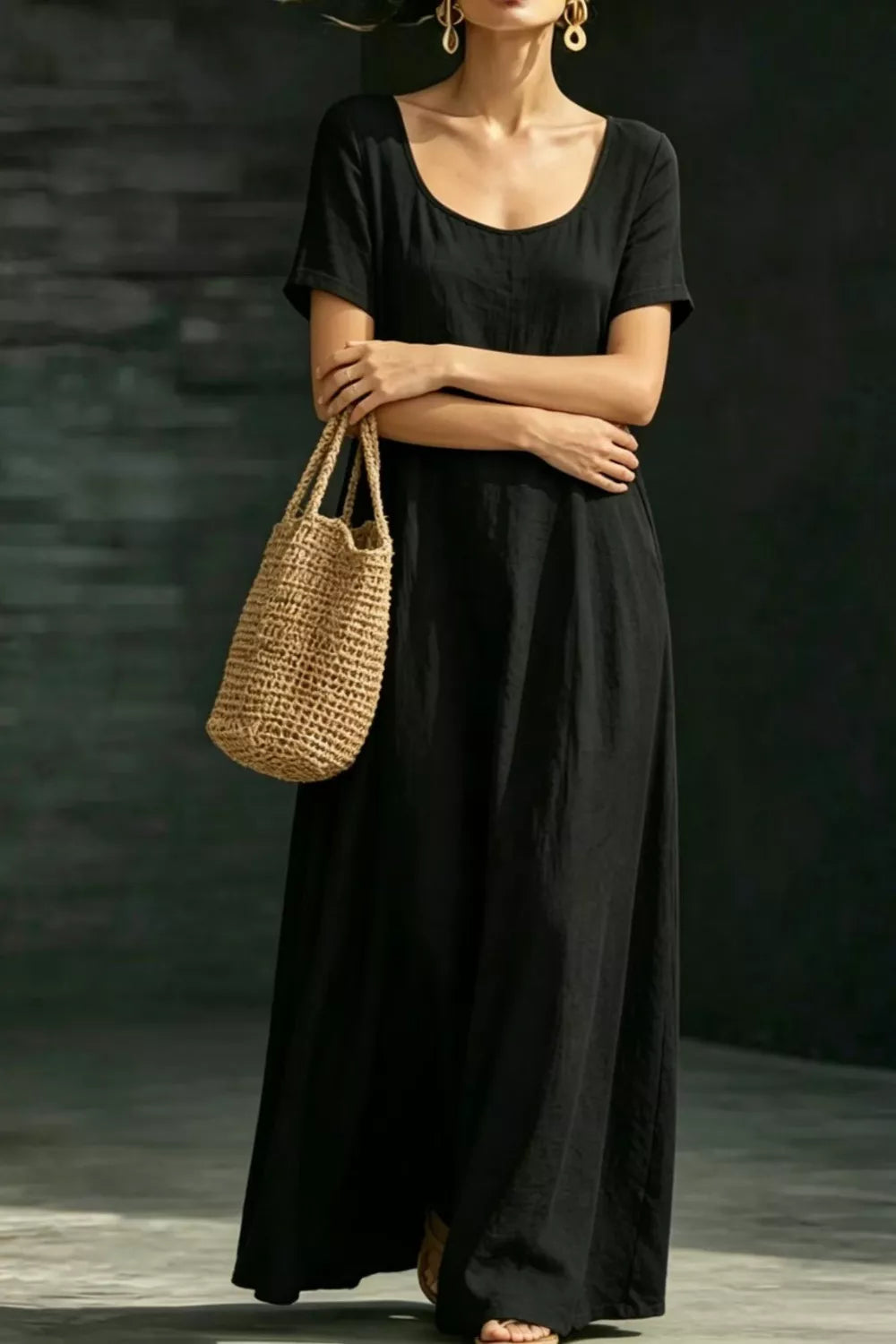 Black polyester maxi dress with short sleeves, scoop neck, and hidden pockets.