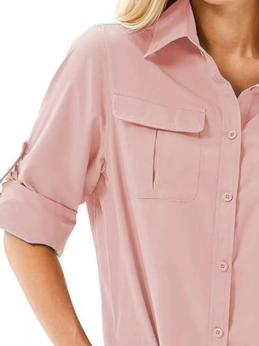 Pink button-up shirt with roll-up sleeves and chest pockets