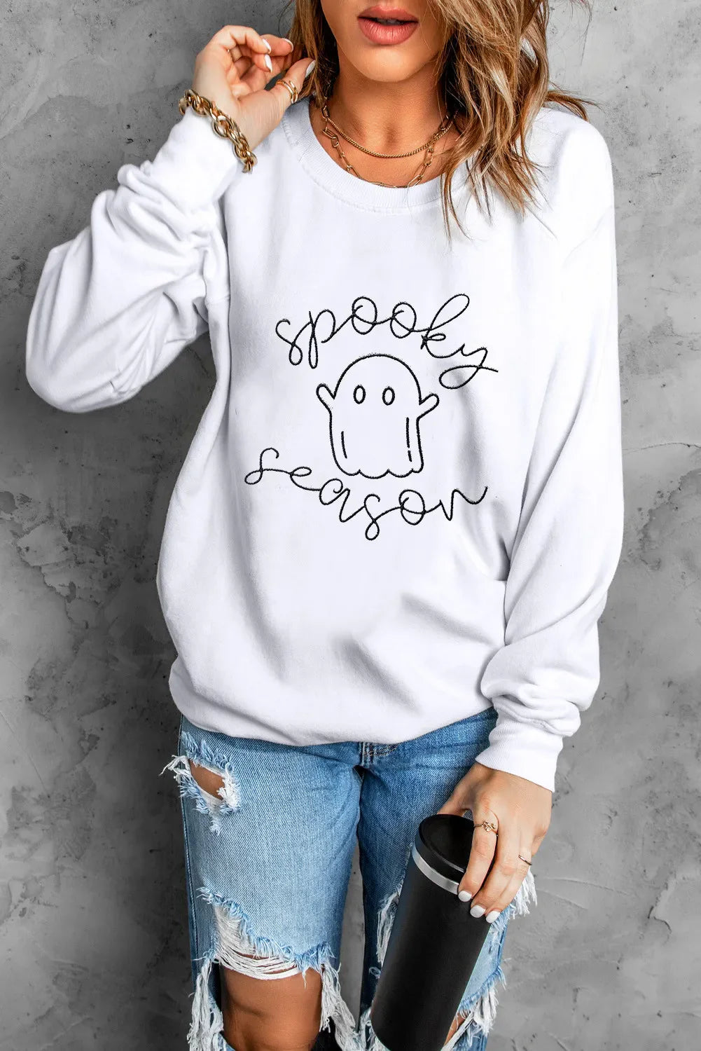 White crewneck sweatshirt with black "spooky season" ghost graphic.