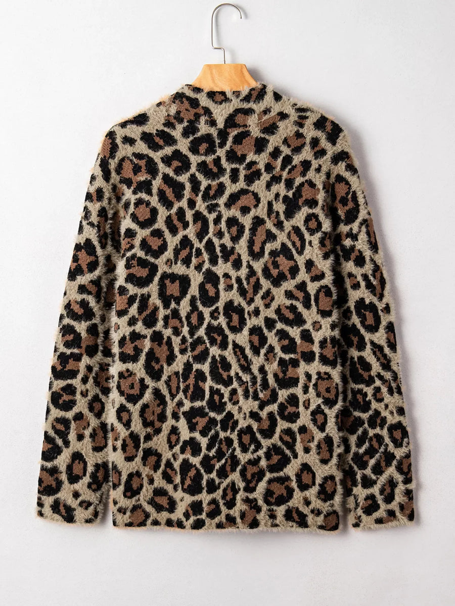 Leopard print fuzzy cardigan with pockets and side slits.