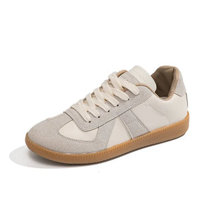 Beige and white retro panel leather sneakers with suede accents and gum sole.
