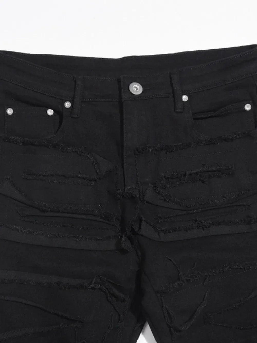 Black denim jeans with layered frayed detailing and a sculpted fit.