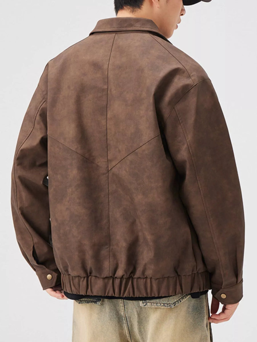 Brown vintage leather jacket with zip up front and elasticated hem.
