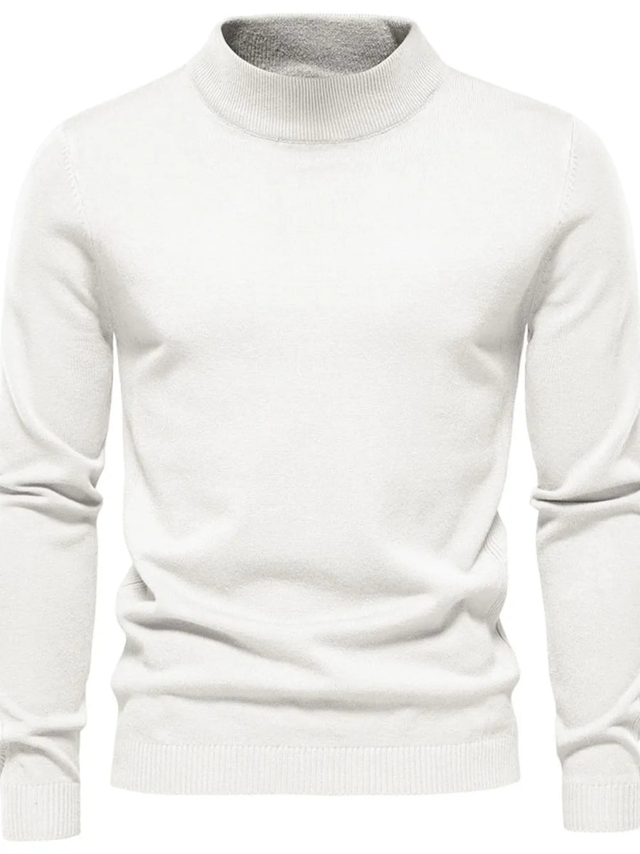 White ribbed mock neck sweater with sculpted shoulders and a classic fit.