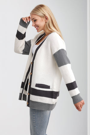 White waffle knit cardigan with grey and black stripes and long sleeves