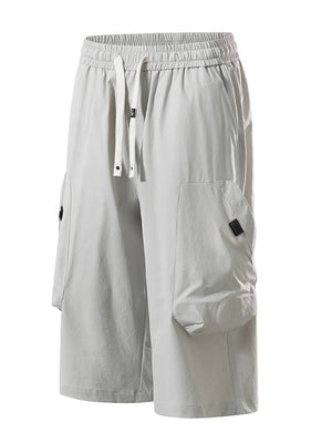 Light gray cargo capris with adjustable drawstring and large side pockets.
