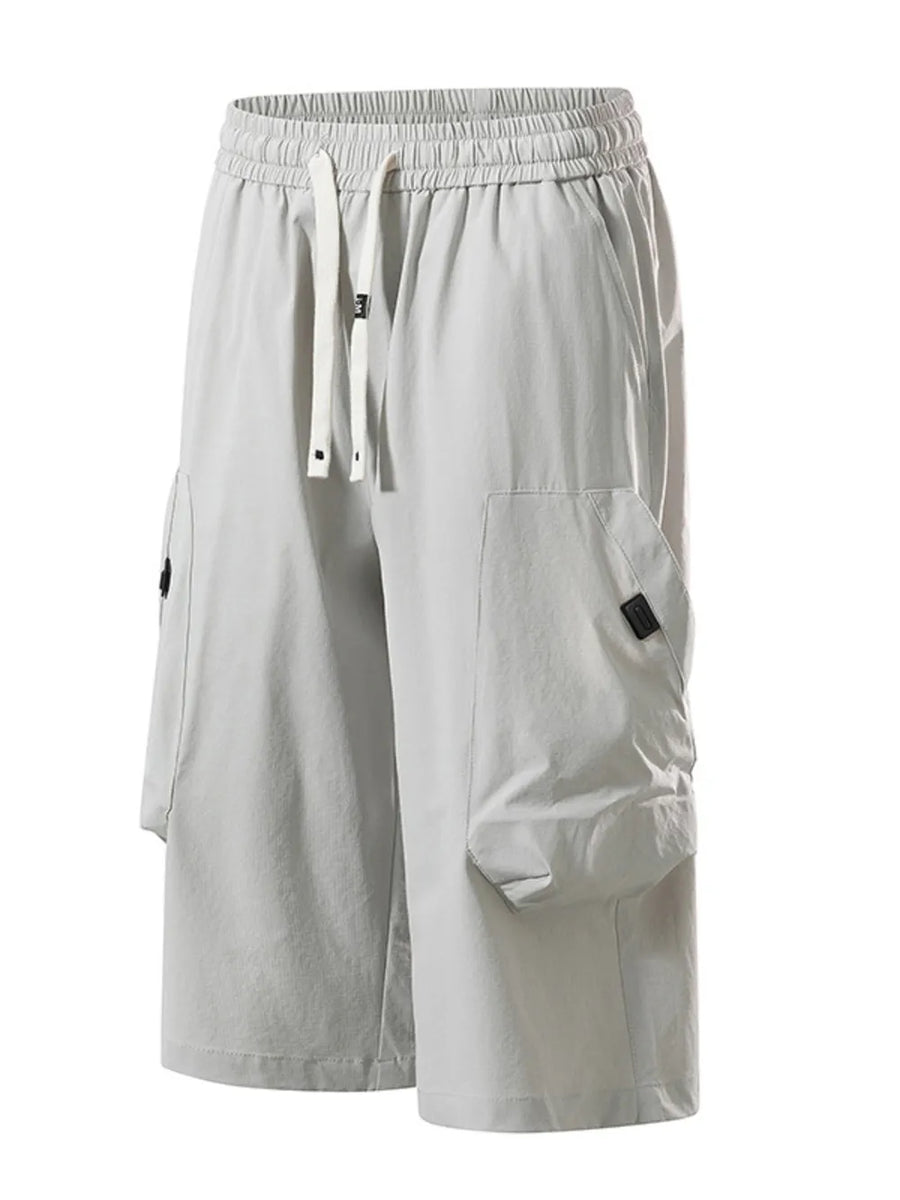 Light gray cargo capris with adjustable drawstring and large side pockets.
