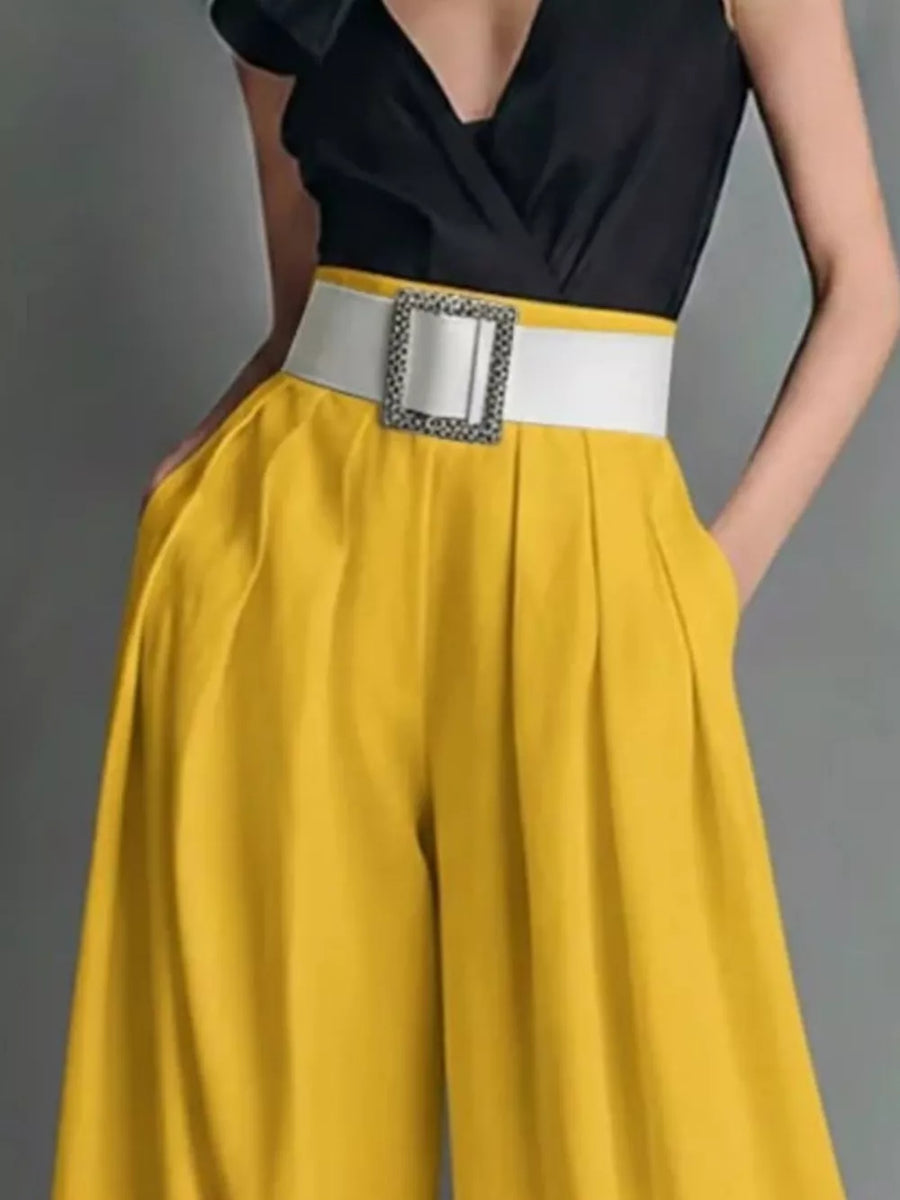 Yellow high-waisted wide-leg pants with a white belt and silver buckle.