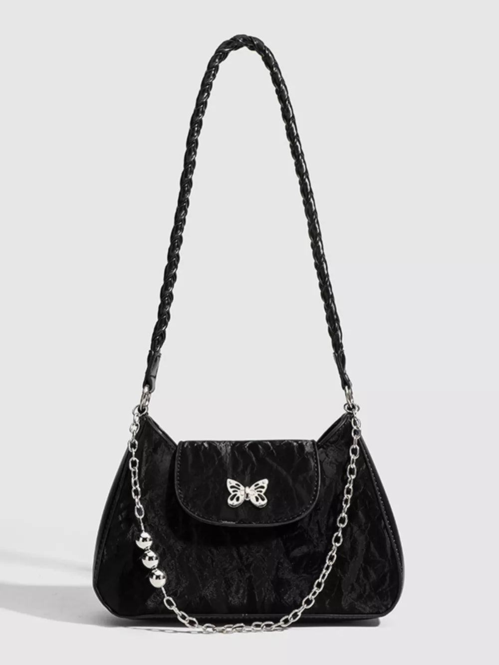 Black shoulder bag with textured fabric, butterfly clasp, beaded chain, and braided strap.
