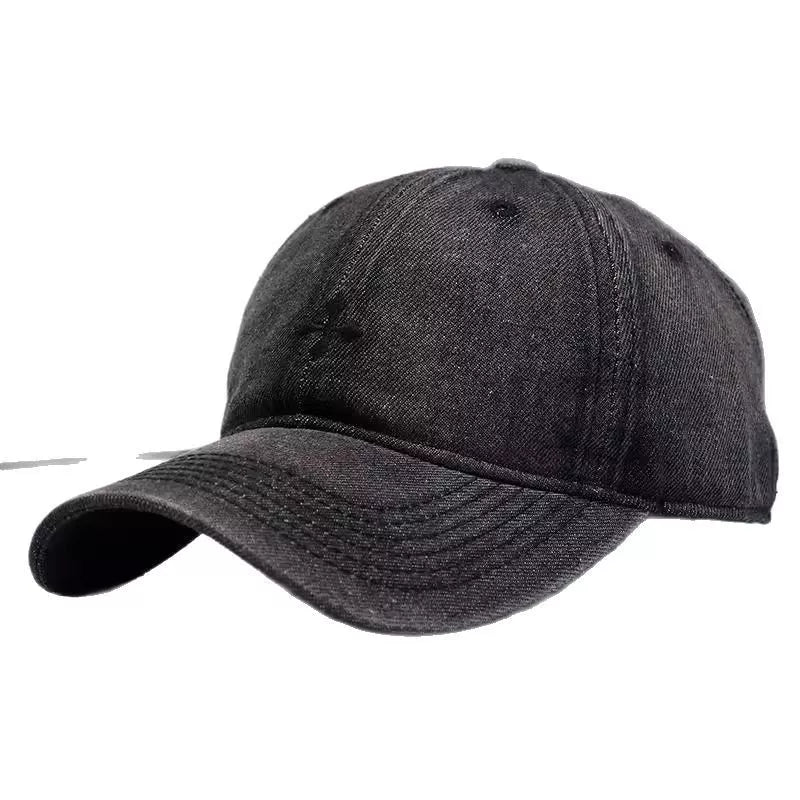 Black denim baseball hat with subtle embroidered detail and curved brim.