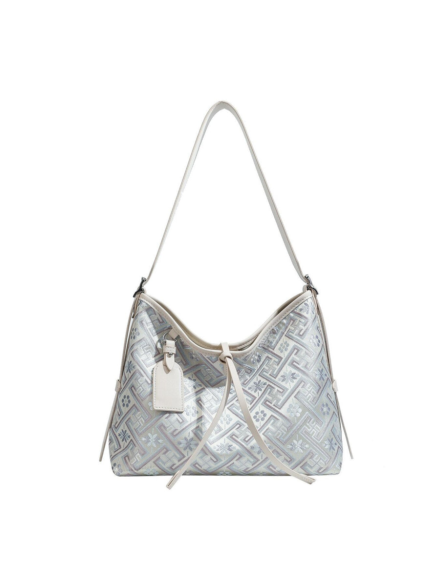 handbag in Light Blue with adjustable strap and medium