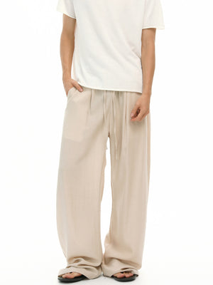 light beige wide-leg pants with full-length and drawstring
