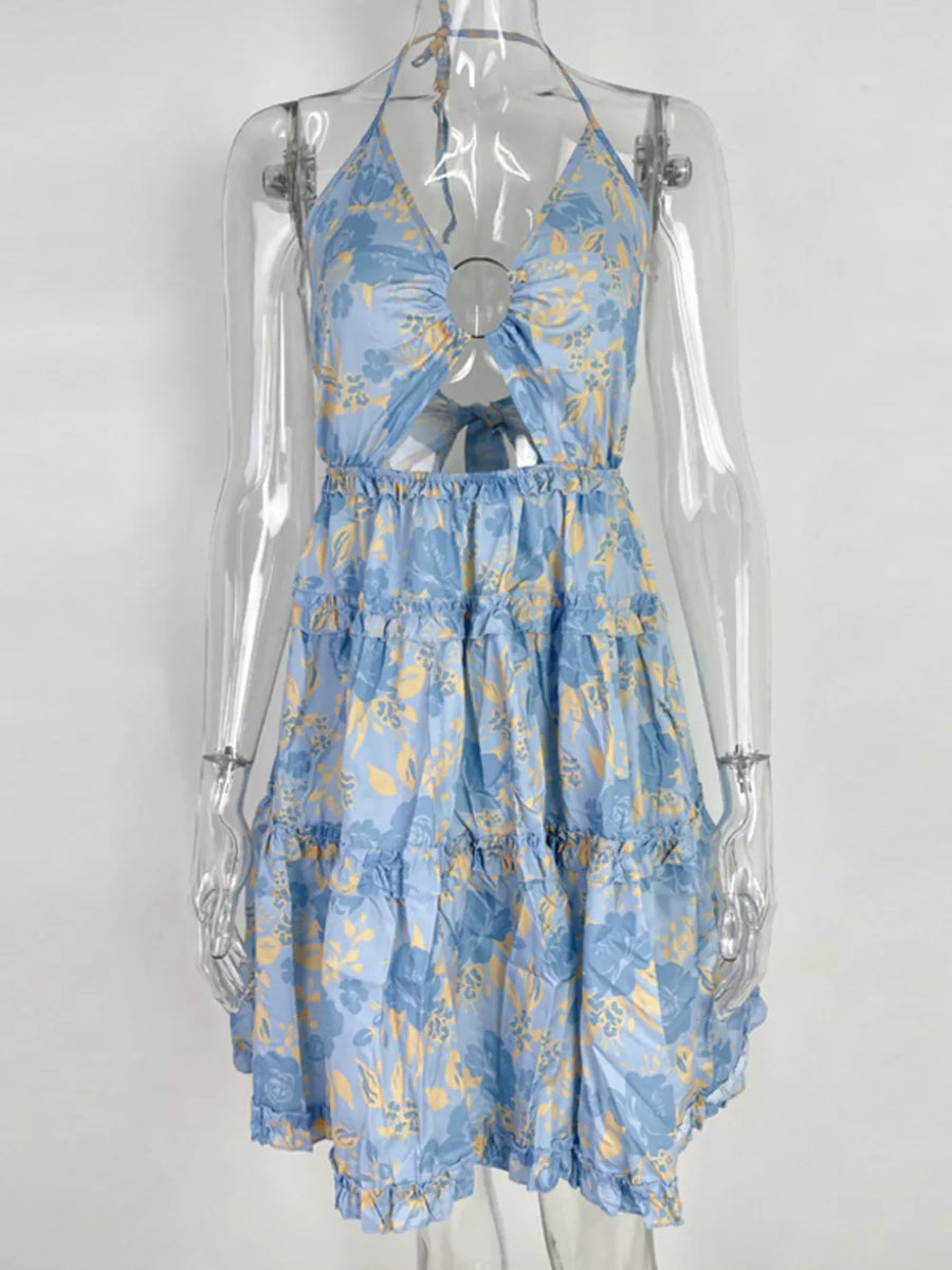 Pastel blue halter mini dress with abstract floral print, cutout, and tiered ruffles.
