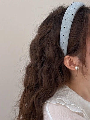 Light blue polka dot padded headband with handmade label detail