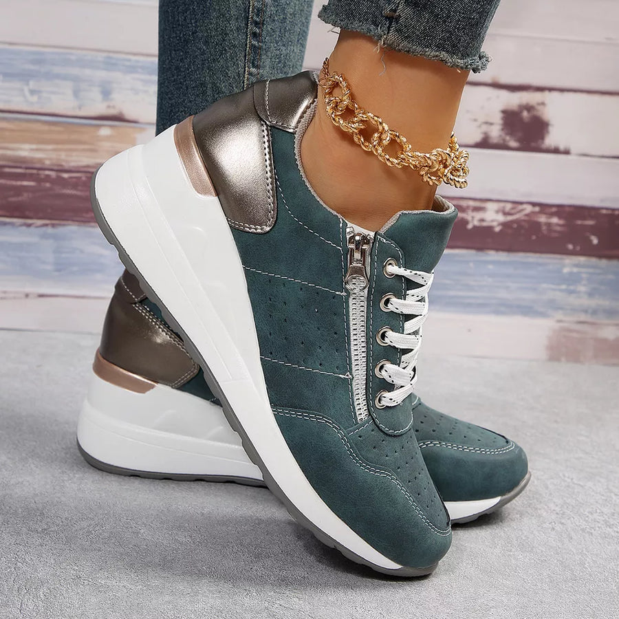 Dark green lace-up wedge sneakers with side zip and metallic accents.