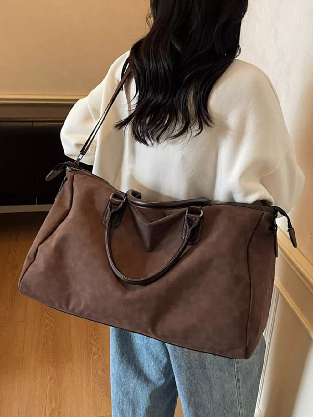 Chocolate suede duffel bag with adjustable strap and leather handles