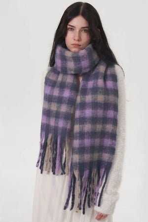 Plush checkered fringe scarf in lilac and grey with fuzzy texture and tasseled ends.