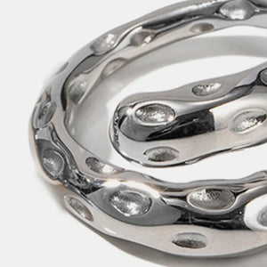 Sculpted silver bubble ring with organic, fluid design and cutouts.
