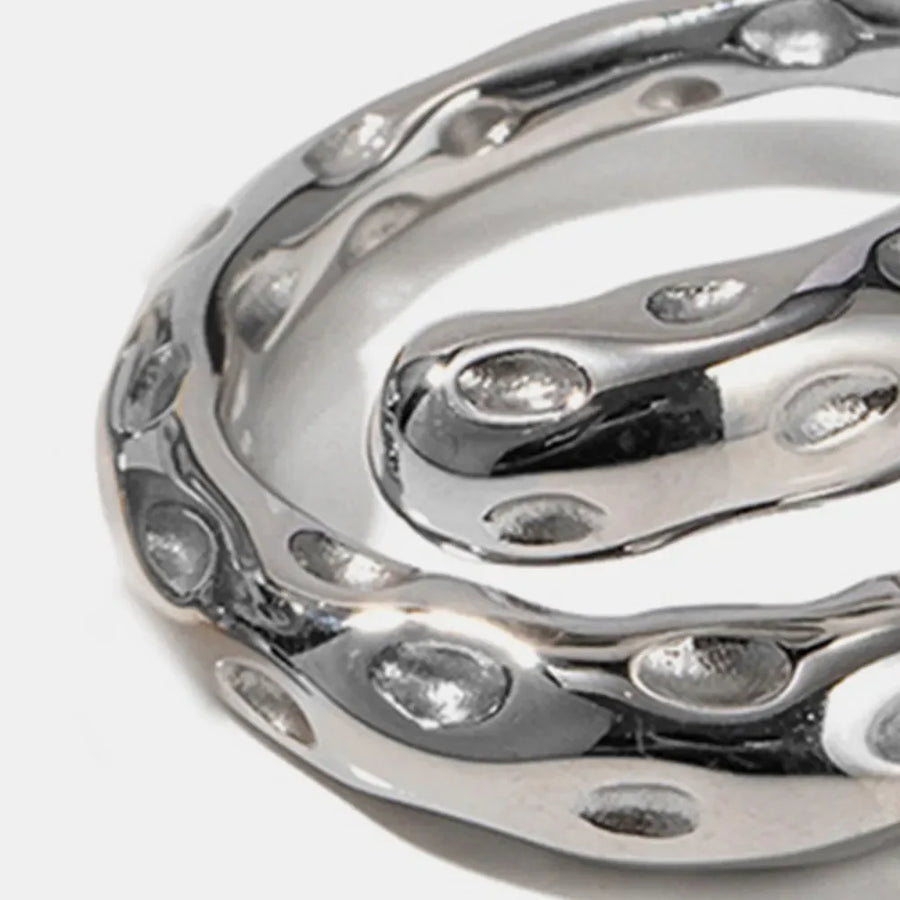 Sculpted silver bubble ring with organic, fluid design and cutouts.