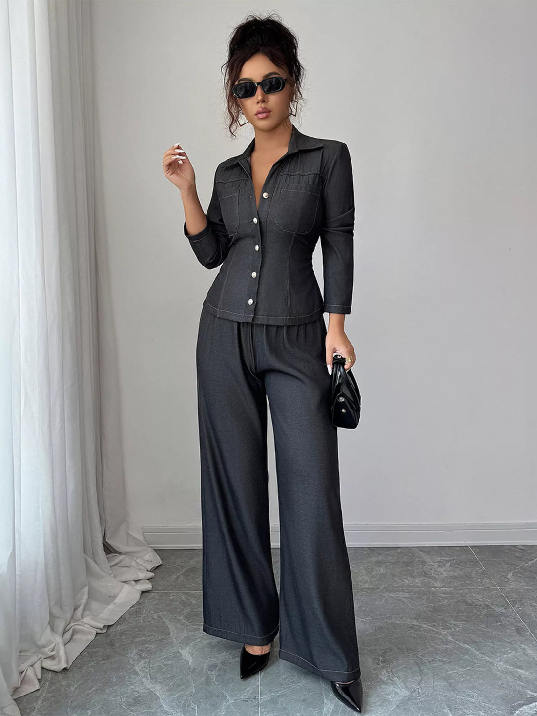 Gray button-up shirt and wide-leg pants set with button details and elastic waist.
