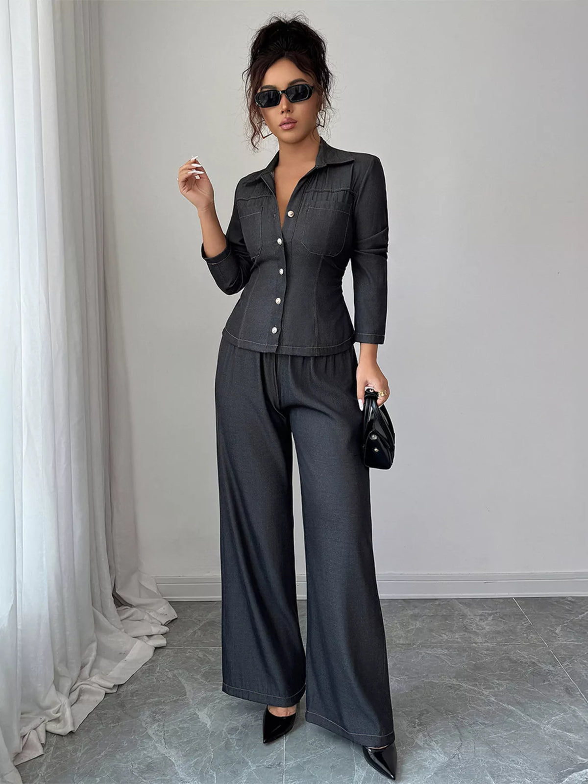 Gray button-up shirt and wide-leg pants set with button details and elastic waist.