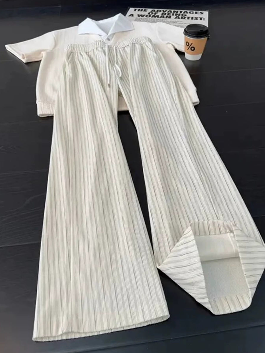wide-leg pants in cream featuring drawstring waist and flared fit