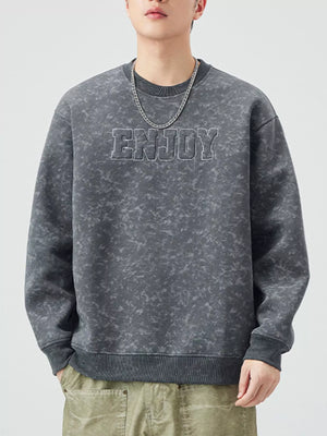 Men's dark gray acid wash sweatshirt with "ENJOY" graphic detail and crew neck.
