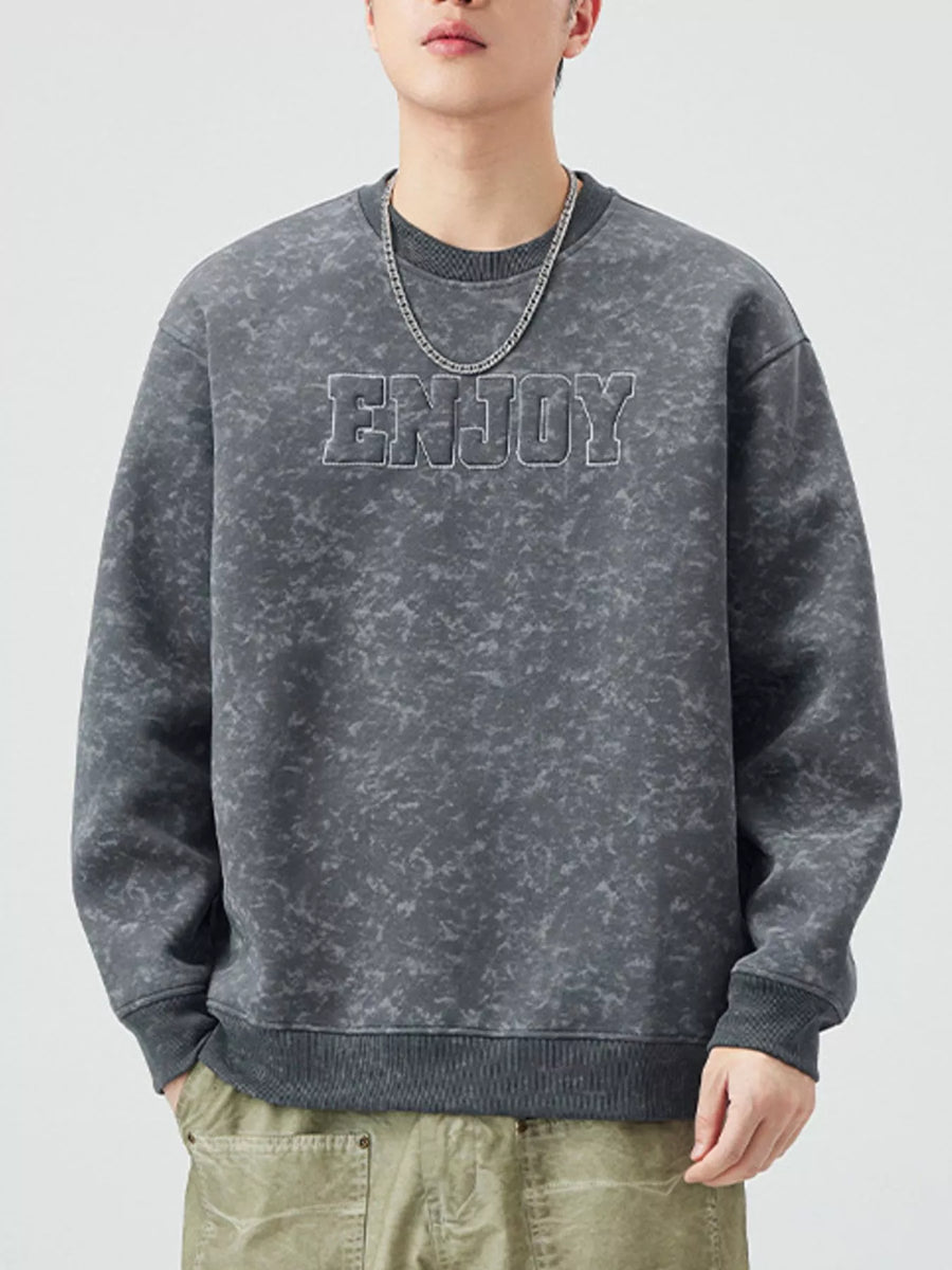 Men's dark gray acid wash sweatshirt with "ENJOY" graphic detail and crew neck.