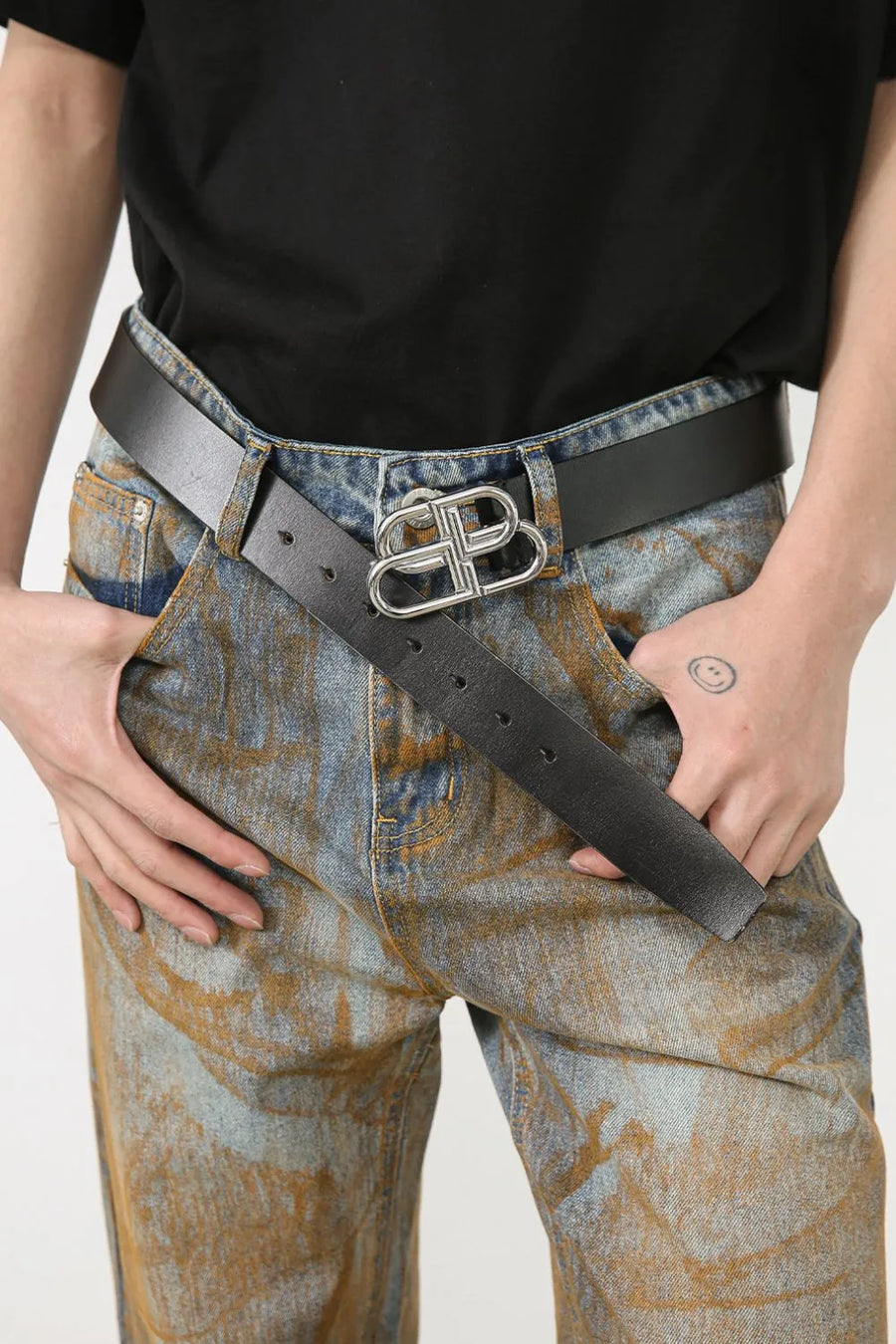 Acid wash denim relaxed fit trousers in medium with a statement silver buckle.