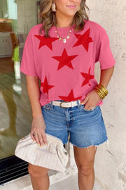 Pink cotton t-shirt with bold red stars, crew neck, short sleeves.
