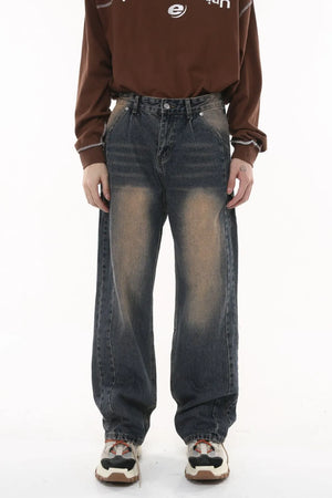 Vintage wash wide-leg jeans in dark gray with a faded effect and pleated front.