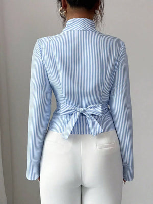 Blue striped long sleeve wrap blouse with a back tie detail.