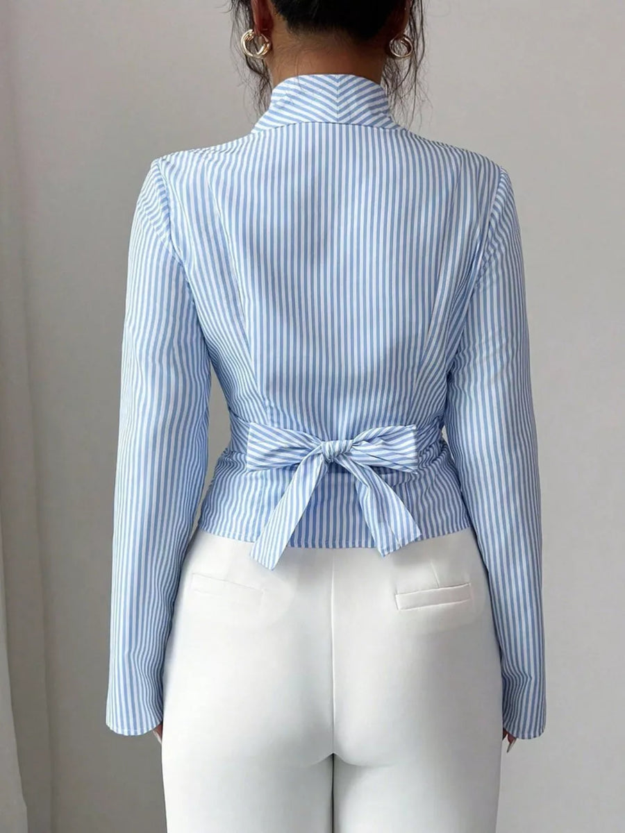 Blue striped long sleeve wrap blouse with a back tie detail.