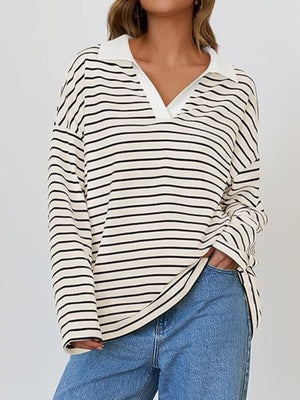 Oversized striped long-sleeve sweatshirt in cream and black with a white collar and v-neck.