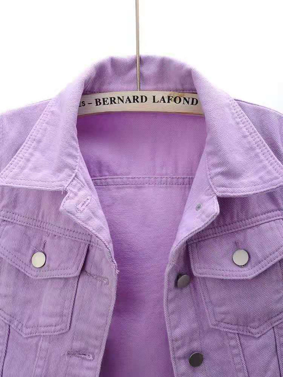 Lavender denim trucker jacket with button pockets and collar detail.