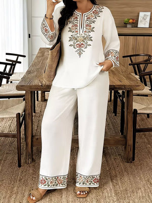 White embroidered peasant top with wide-leg pants set.