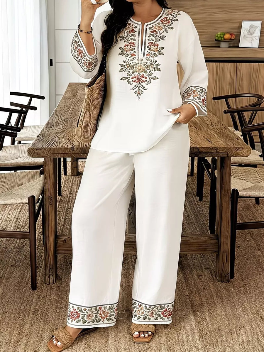 White embroidered peasant top with wide-leg pants set.