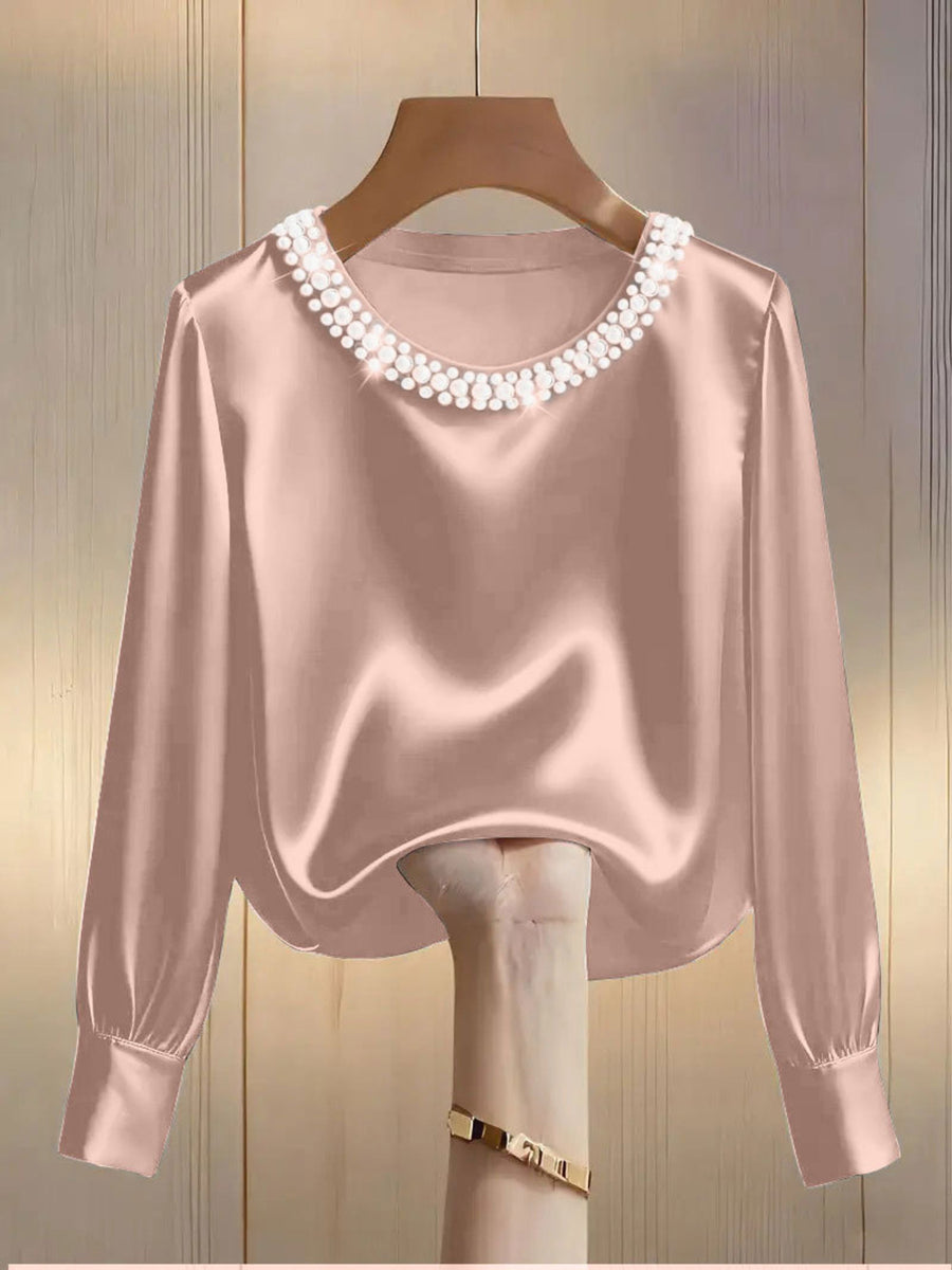 Pink satin blouse with pearl trim round neck and long sleeves