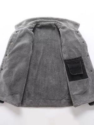 Gray sherpa-lined denim jacket interior with black chest pocket detail