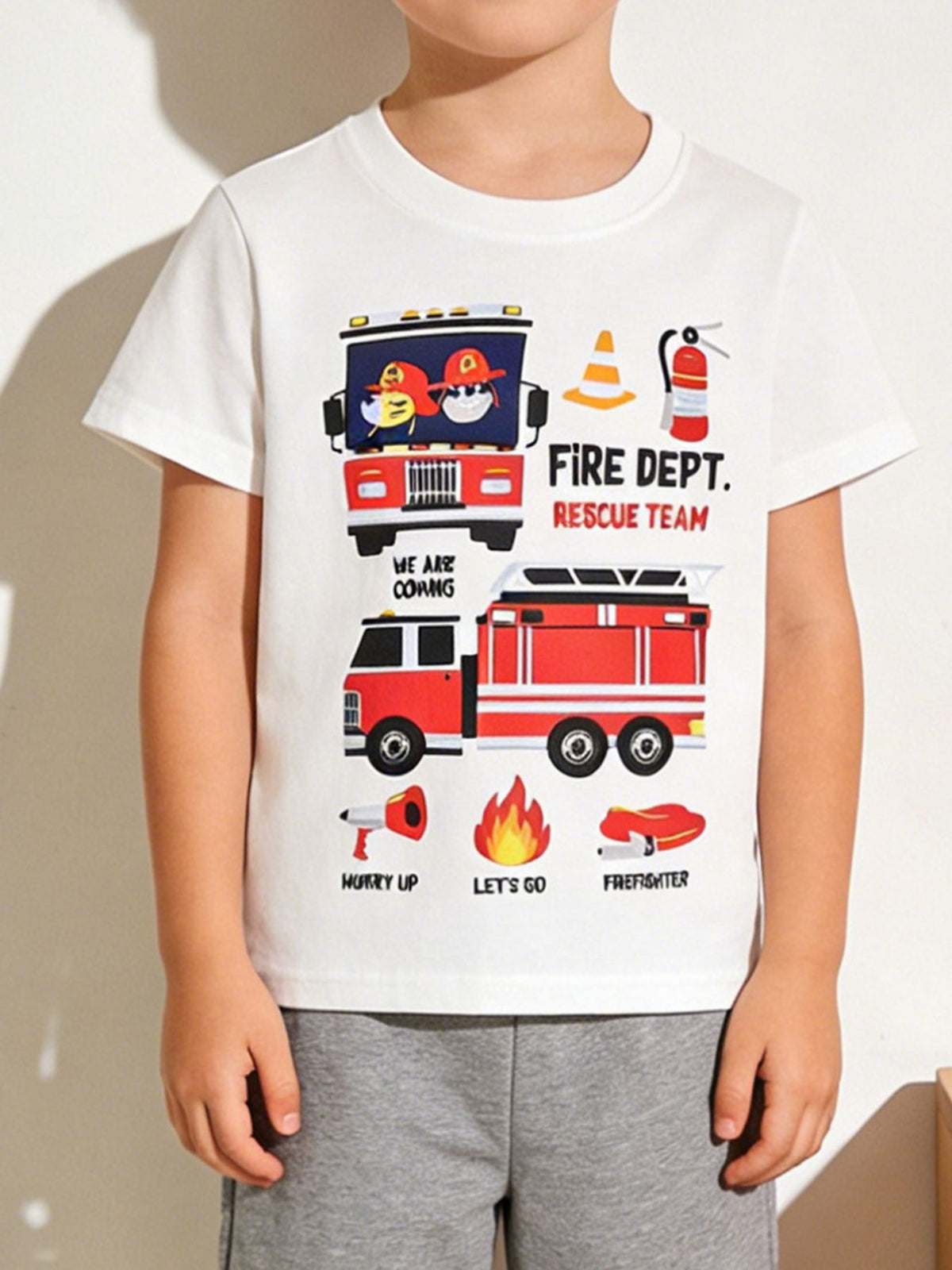White cotton crew neck t-shirt with playful fire truck graphics and rescue team text.