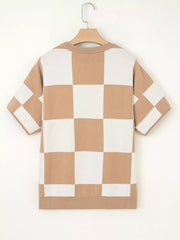 Drop shoulder sweater in camel and white checkerboard pattern with short sleeves.
