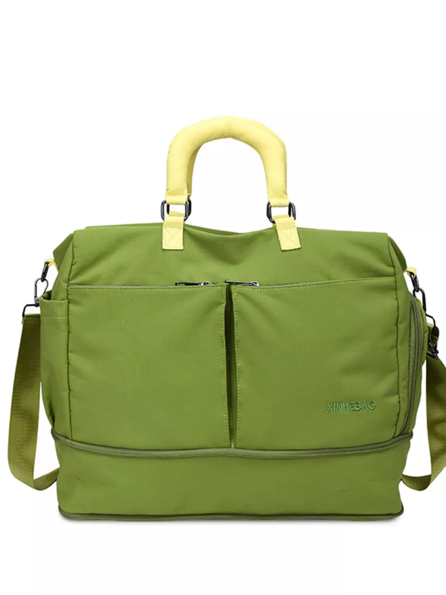 Green travel organizer bag with yellow handles and adjustable strap, featuring multiple pockets.