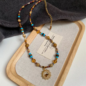 necklace in turquoise with motif and beaded