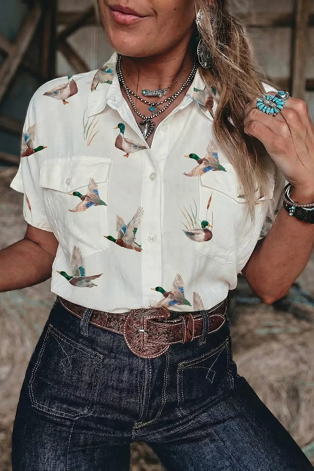 button-up shirt in green with animal-print and button-front