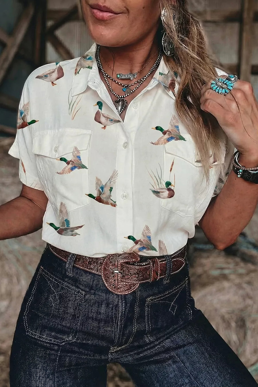 button-up shirt in green with animal-print and button-front