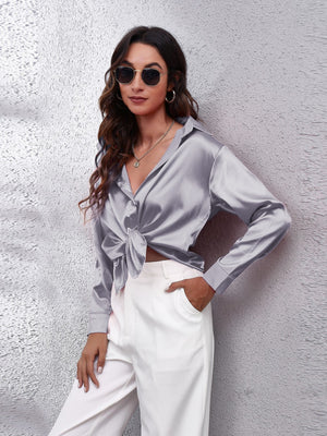 Satin finish button-up shirt in silver with a knotted front and collar.