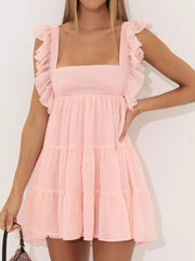 Pink ruffled square neck mini dress with tiered skirt and short ruffled sleeves.