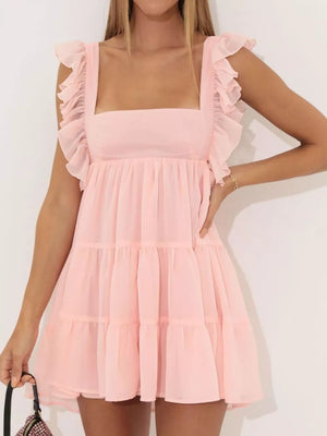 Pink ruffled square neck mini dress with tiered skirt and short ruffled sleeves.