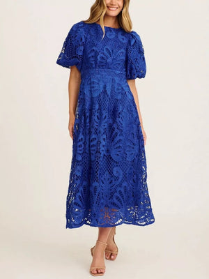 Blue lace midi dress with puff sleeves and intricate allover pattern.